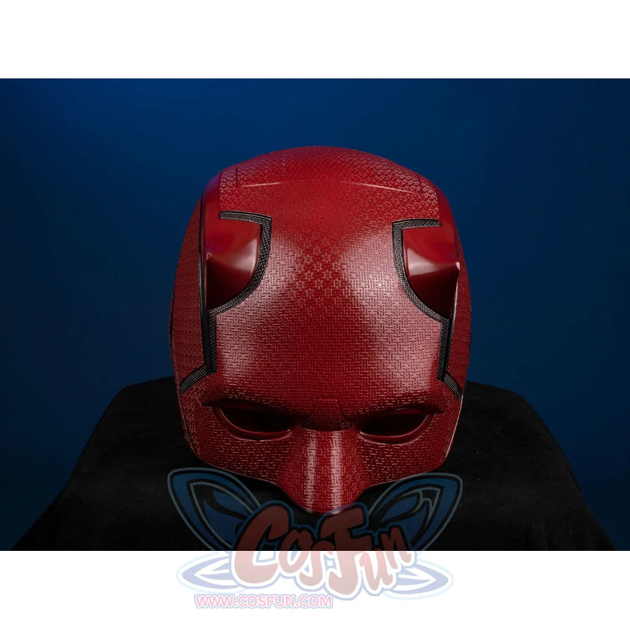 Matt Murdock cosplay helmet curves into a red fiberglass frame that anchors distinct horn shapes and a textured finish.