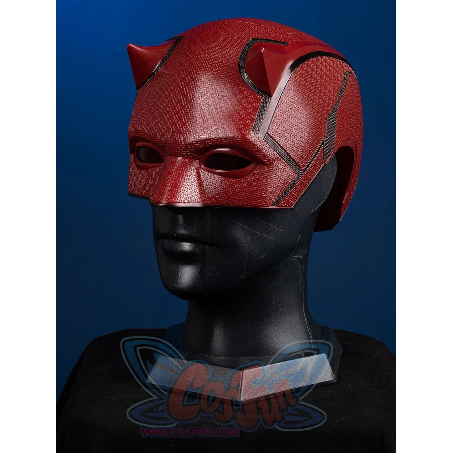 Matt Murdock cosplay helmet curves across the head with a red textured finish and two sharp horns along the upper rim.