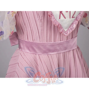 Melanie Martinez K-12 Cry Baby cosplay waist detail anchors the satin belt above a pleated pink skirt.