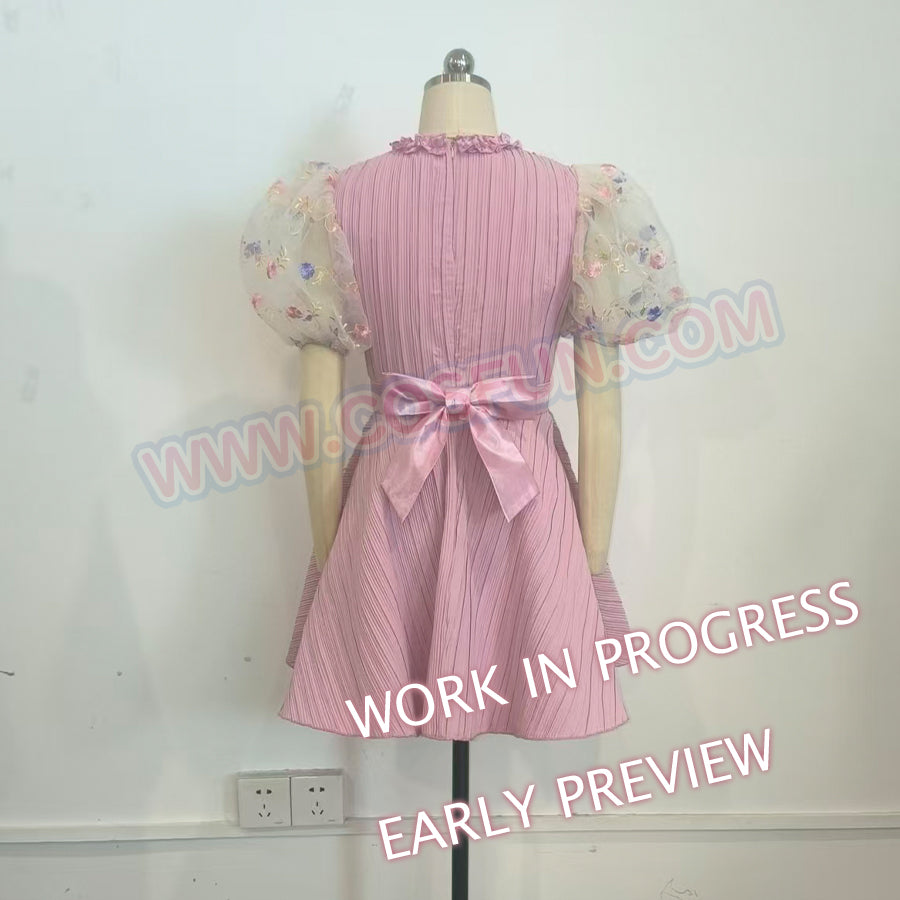 Melanie Martinez K-12 Cry Baby cosplay pink dress back view places a satin bow beneath sheer floral puff sleeves