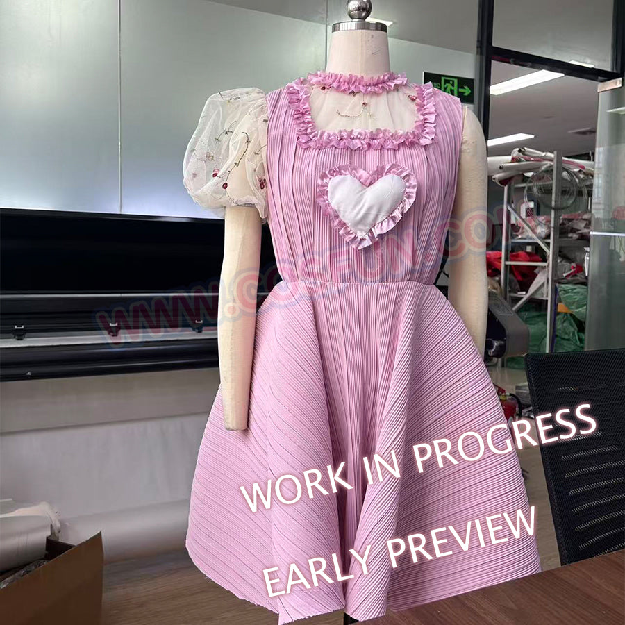 Melanie Martinez K-12 Cry Baby cosplay pink dress close-up highlights the ruffled neckline and flared pleated skirt