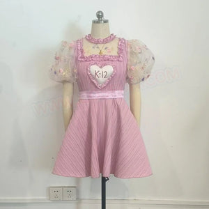COSFUN Melanie Martinez K-12 Cry Baby cosplay pink dress front view sets puff sleeves around a heart chest panel