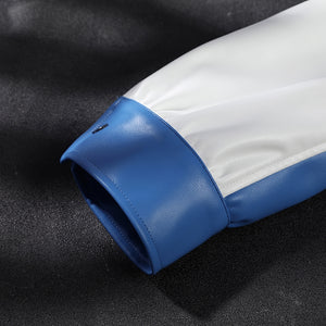Mister Fantastic Reed Richards cosplay costume captures the detail of a white faux leather sleeve cuff beside blue trim.