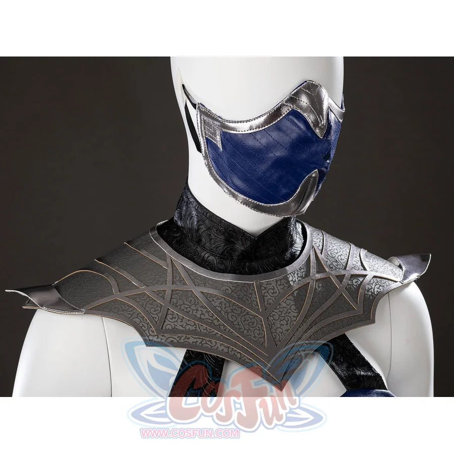 Mortal Kombat 2 Kitana cosplay mask detail sets blue face panels beneath etched gray shoulder armor.