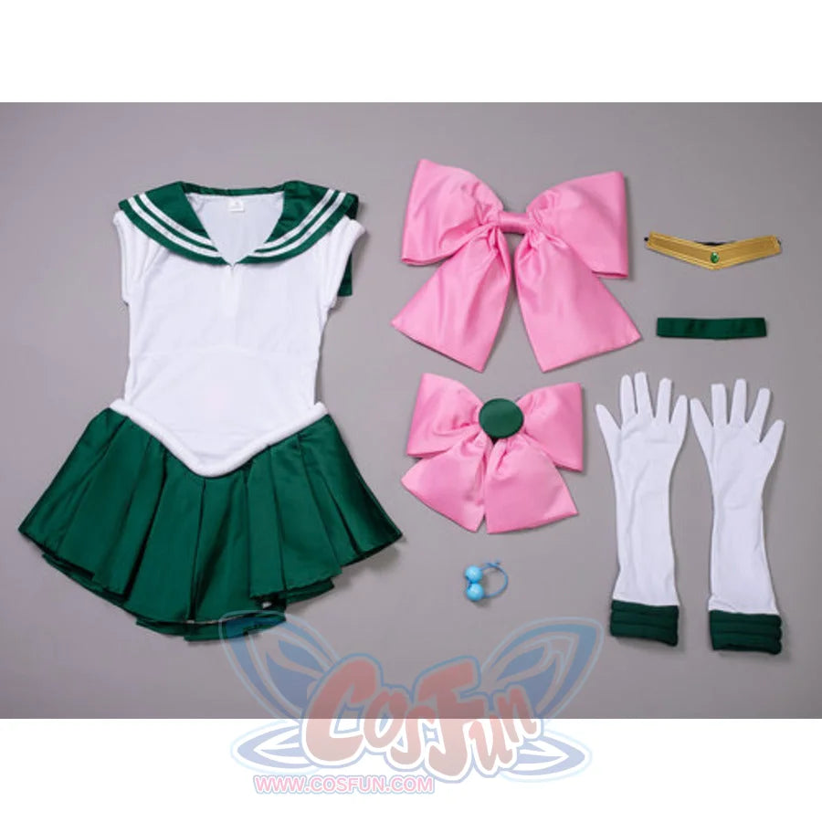 Makoto Kino cosplay costume flat lay gathers two large pink bows beside white gloves and a gold tiara with green trim.