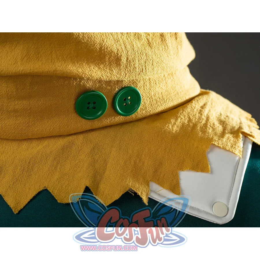 My Hero Academia Deku cosplay cape detail places green buttons along a jagged yellow scarf edge.