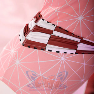 Close-up of the Nezuko cosplay swimsuit waist highlighting a red-and-white checkered band and pink print