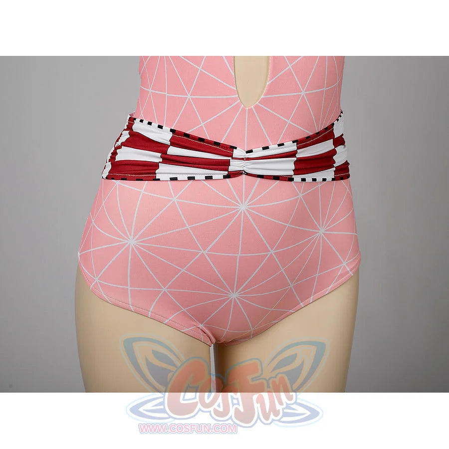 Nezuko cosplay swimsuit waist detail anchors red checked trim across the pink one-piece.