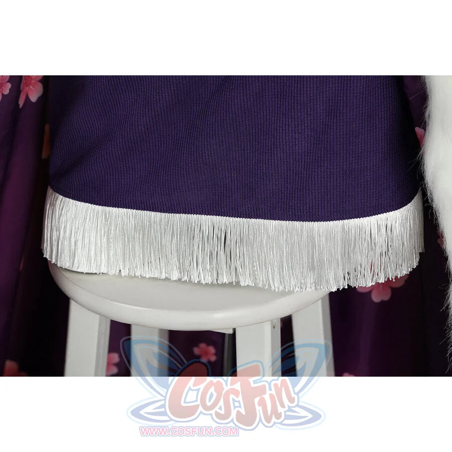 Close-up of Nico Robin cosplay costume lower hem with purple edge, long white fringe, floral fabric, and fur trim