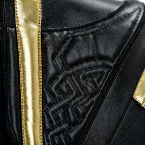 Final Fantasy XV Noctis The Chosen King cosplay costume layers intricate black quilted patterns beside sleek gold-tone trim.