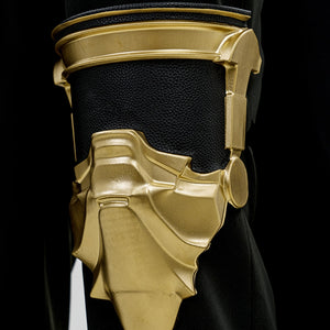Final Fantasy XV Noctis The Chosen King cosplay costume leg armor piece frames black fabric in a gold-tone sculpted finish.