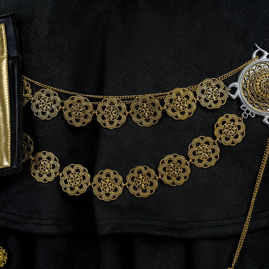 Final Fantasy XV Noctis The Chosen King cosplay costume layers gold-tone floral waist ornaments over dark fabric.