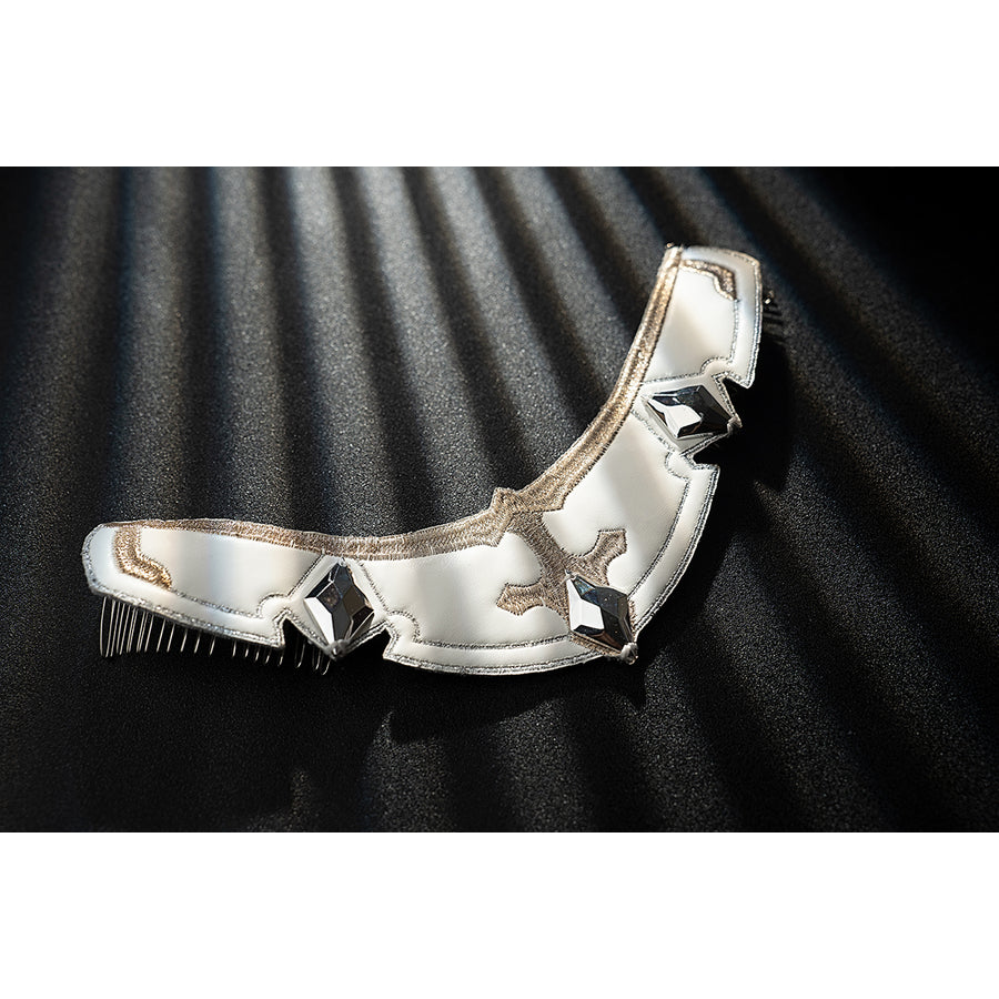 Genshin Impact Noelle cosplay arm guard flat lay shows white armor segments edged in gold trim.