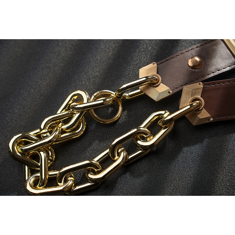 Genshin Impact Noelle cosplay belt chain detail focuses on gold-tone links over brown straps.