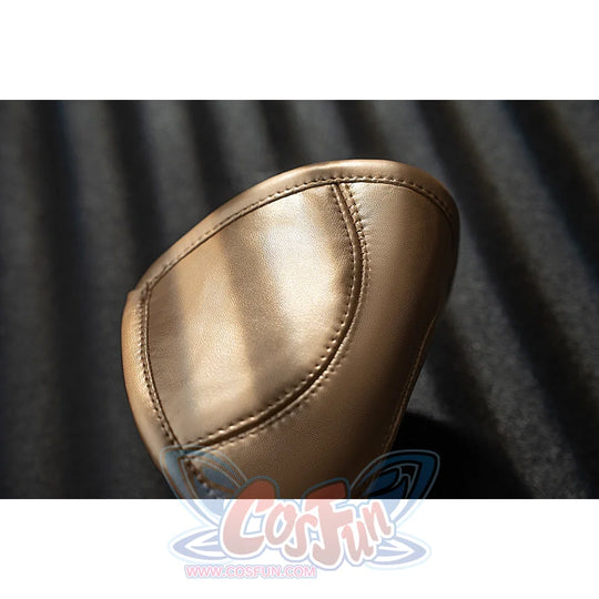 Genshin Impact Noelle cosplay knee pad close-up highlights a white oval panel bordered by gold trim.