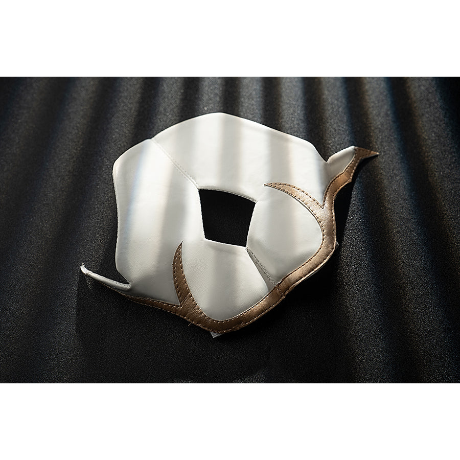 Genshin Impact Noelle cosplay knee pad detail shows white armor edged with gold trim.