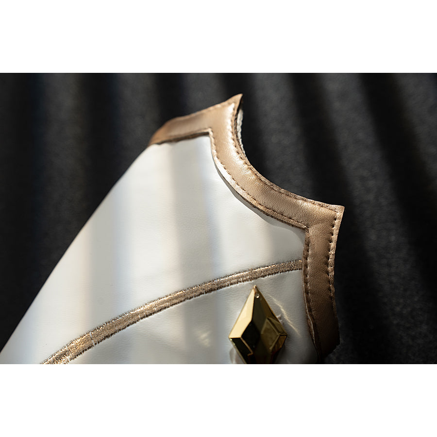 Genshin Impact Noelle cosplay leg guard edge detail shows white armor shaped with gold piping.