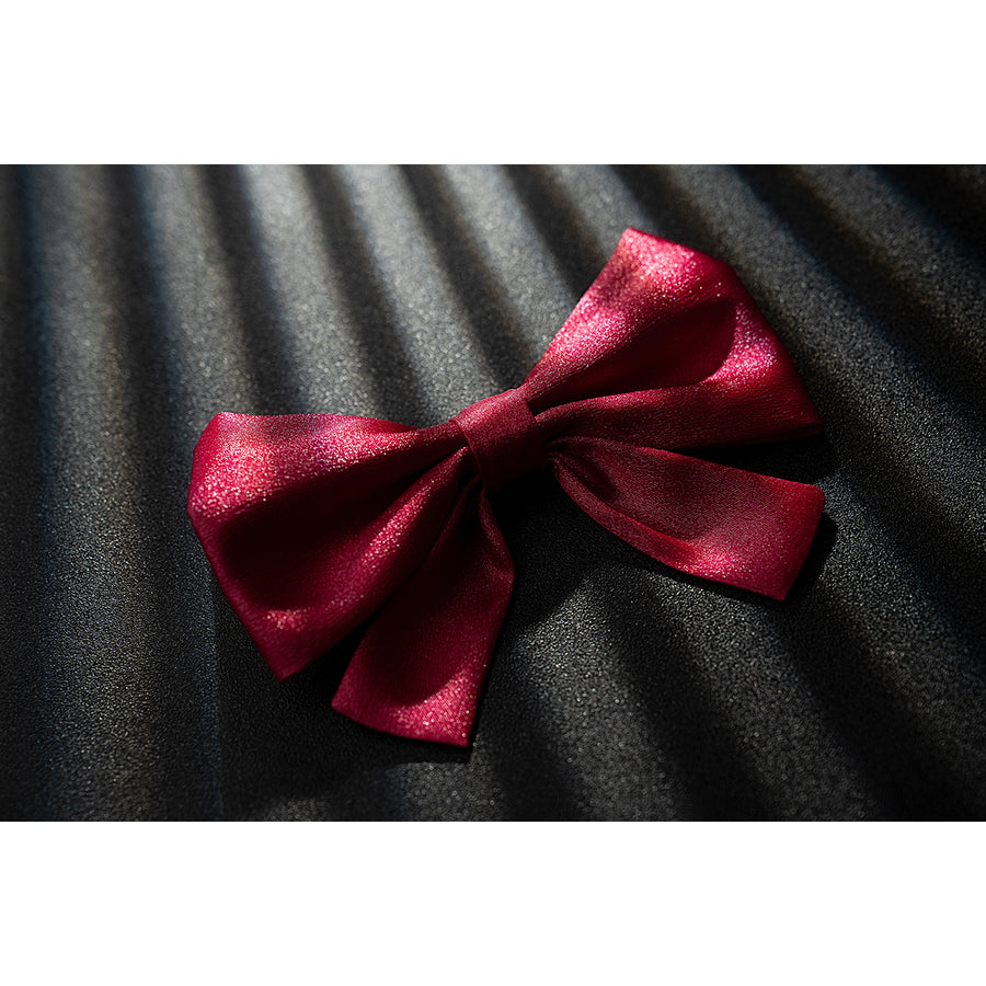 Genshin Impact Noelle cosplay pink bow accessory appears in satin fabric with a tied center knot.
