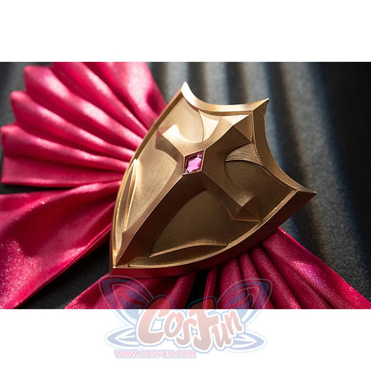 Genshin Impact Noelle cosplay shield decoration close-up sits over pleated pink satin fabric.