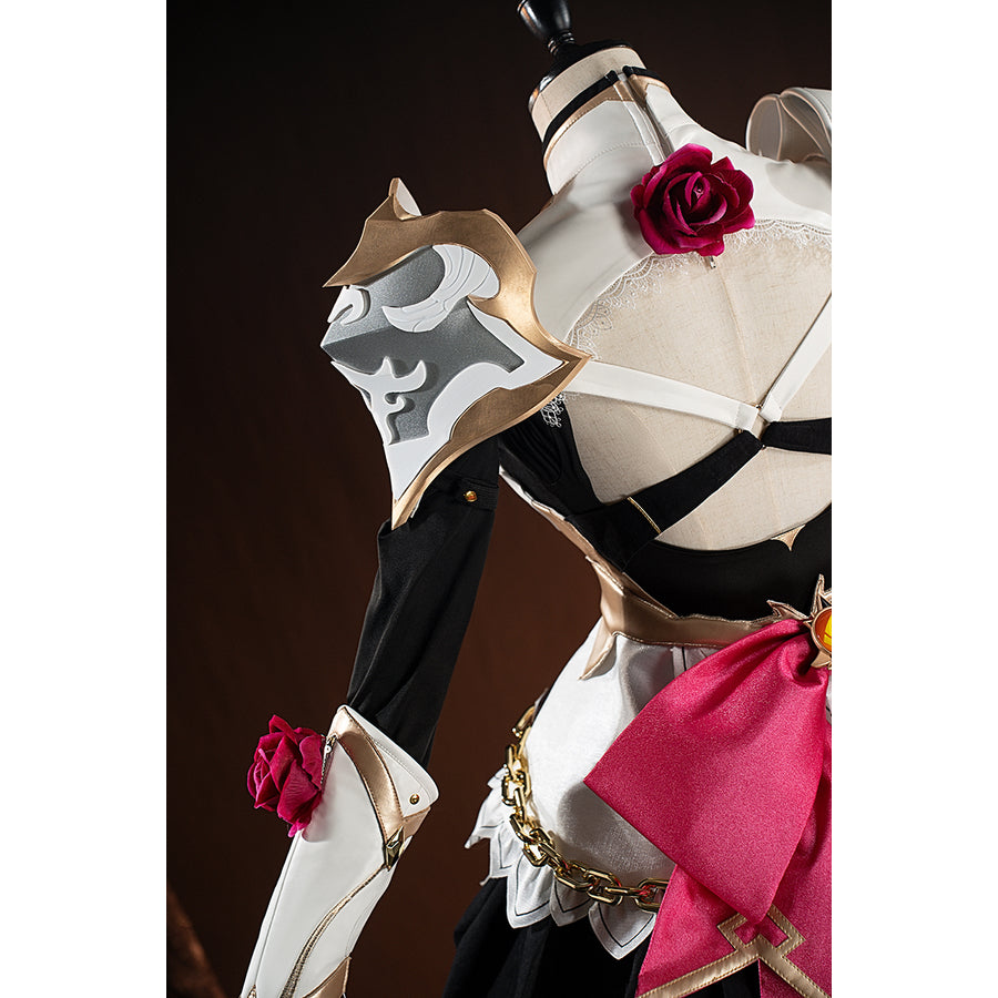 Genshin Impact Noelle cosplay shoulder decoration detail shows a gold-tone emblem on white armor.