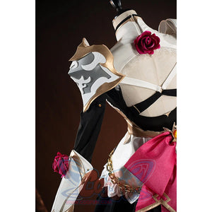 Genshin Impact Noelle cosplay shoulder decoration detail shows a gold-tone emblem on white armor.