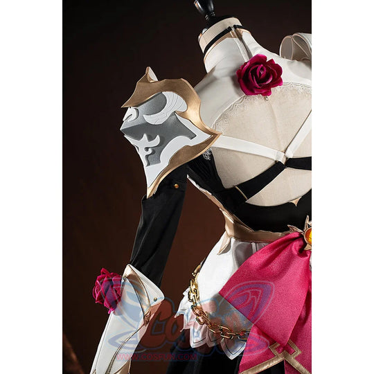 Genshin Impact Noelle cosplay shoulder decoration detail shows a gold-tone emblem on white armor.