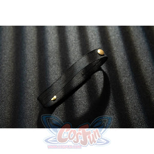 Genshin Impact Noelle cosplay thigh strap detail uses black faux leather finished with gold buttons.