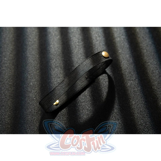 Genshin Impact Noelle cosplay thigh strap detail uses black faux leather finished with gold buttons.