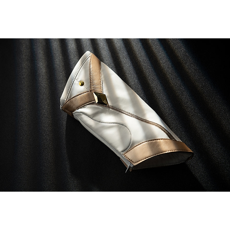 Genshin Impact Noelle cosplay wrist guard piece curves in white and gold over a folded cuff shape.
