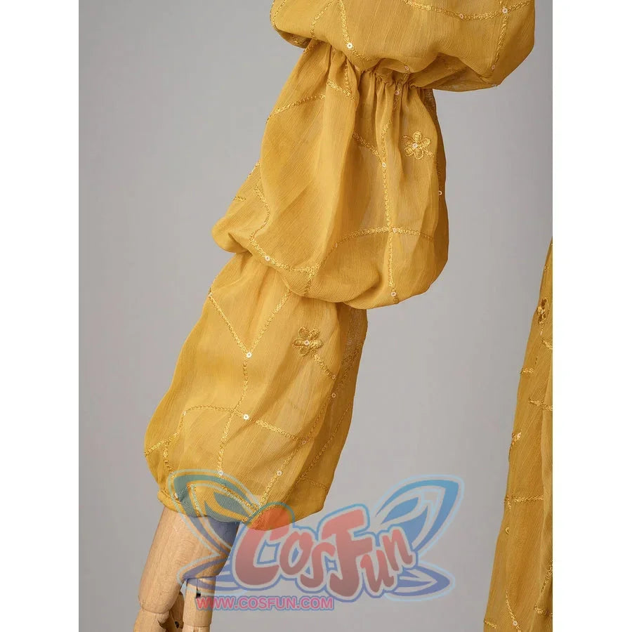 Padmé Amidala cosplay sleeve cuff detail with gathered golden fabric and small embroidered motifs.