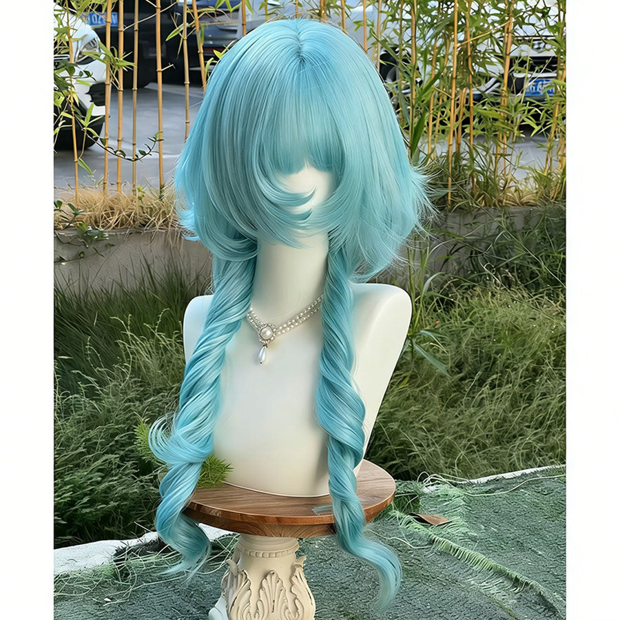 Peacock teal blue lolita wig with long braided pigtails shown on a mannequin outdoors, featuring fluffy bangs and wavy texture with bamboo plants in the background