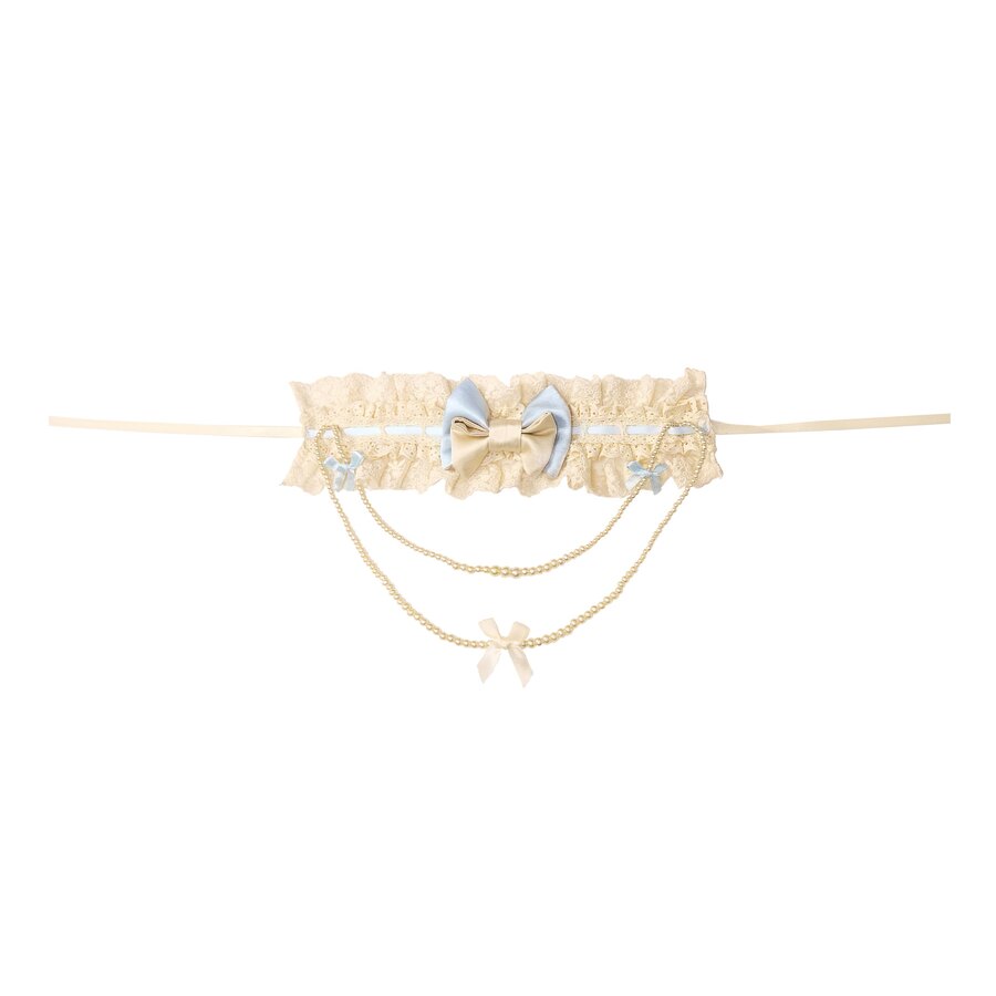 Flat lay of the Bow Pearl Necklace item with blue bow, bow charms, and dangling chain details