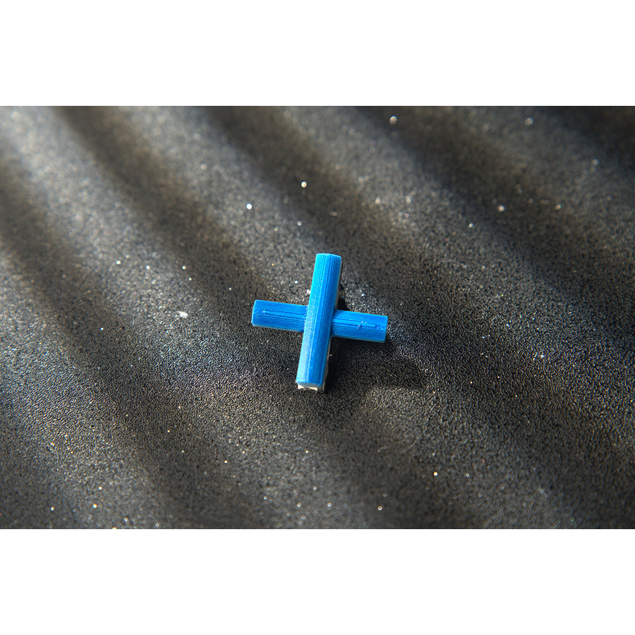 Wuthering Waves Phoebe cosplay blue cross accessory appears as a small bright accent piece.