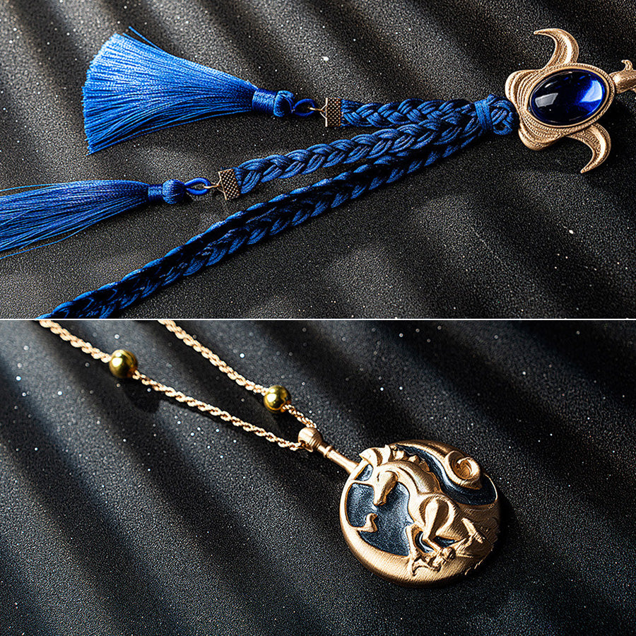 Wuthering Waves Phoebe cosplay pendant detail links blue braided tassels to a gold-tone charm with a gem-like blue accent