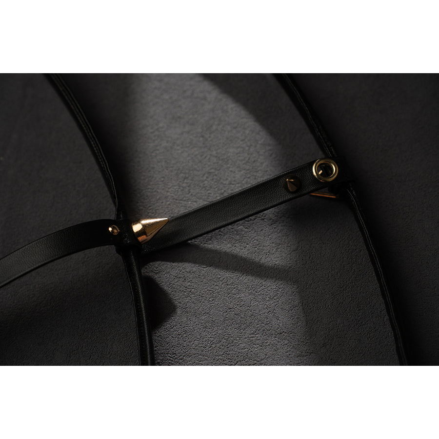 Wuthering Waves Phrolova cosplay black strap detail shows gold-tone rivets and slim faux leather.