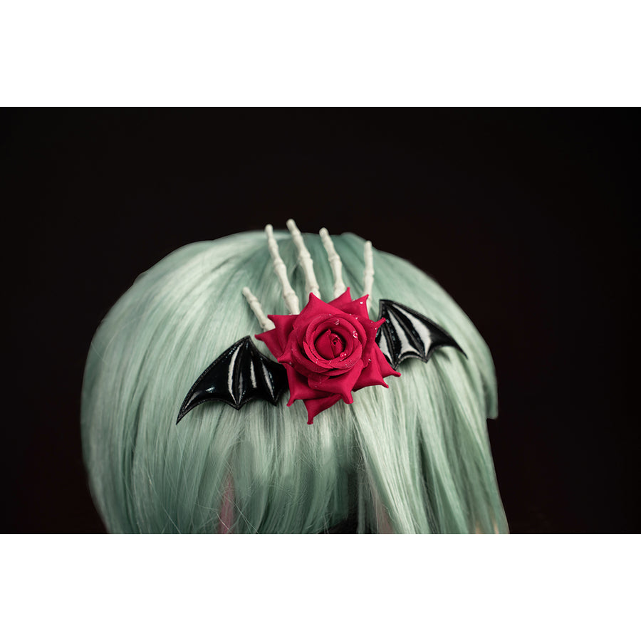 Wuthering Waves Phrolova cosplay rose headpiece close-up frames red petals with silver-tone spikes.