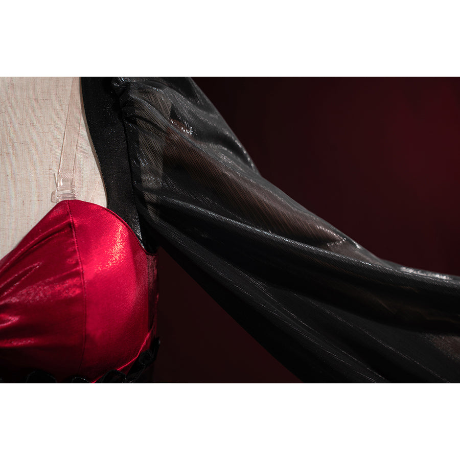 Wuthering Waves Phrolova cosplay sleeve detail shows glossy black fabric flowing from the red bodice.