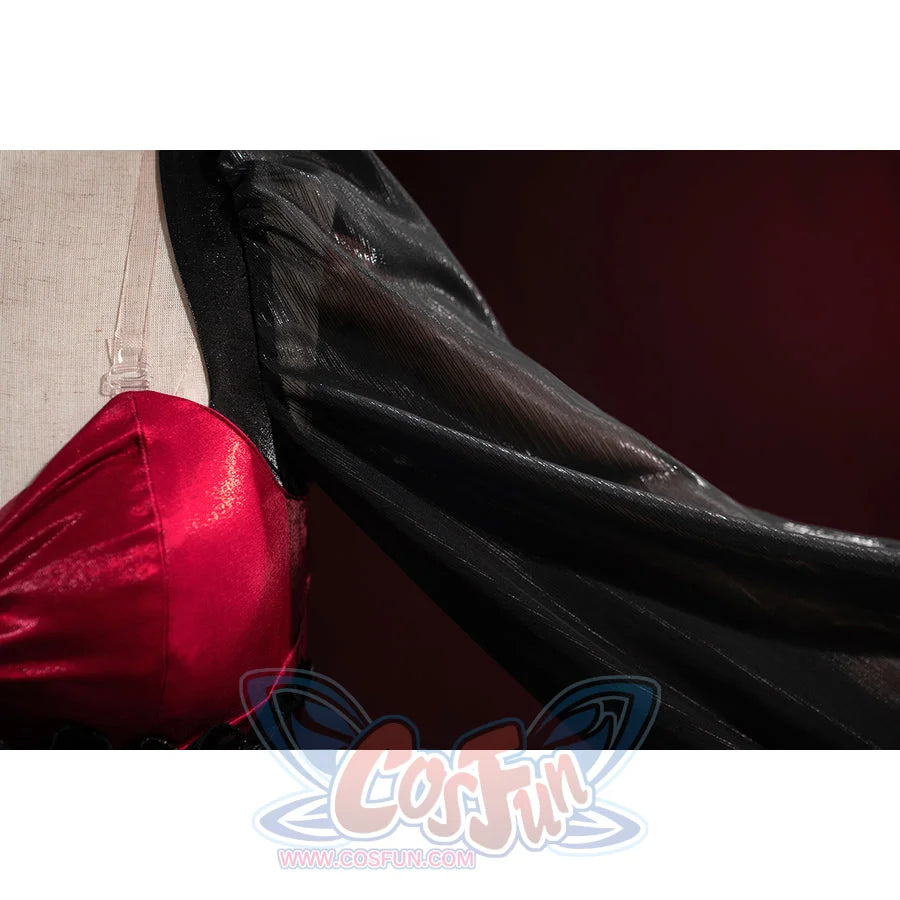 Wuthering Waves Phrolova cosplay sleeve detail shows glossy black fabric flowing from the red bodice.