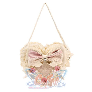 Pink heart cake handbag flat lay with lace ruffles, satin bow, and cherry accents