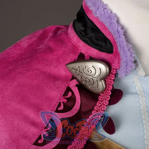 Princess Anna cosplay cape detail centers an engraved silver-tone clasp beside plush purple collar trim.