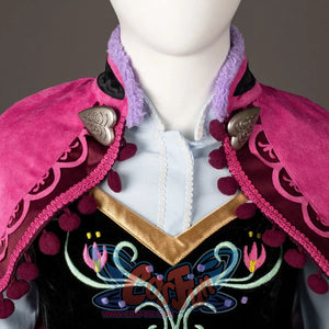 Princess Anna cosplay costume neckline detail frames the embroidered bodice beneath a silver-tone cape clasp.