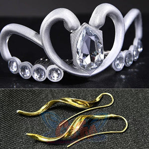 Sailor Soldiers Princess Serenity cosplay crown and earrings pair a silver-tone tiara with curved gold-tone drops.