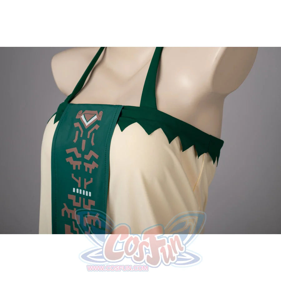 Princess Zelda cosplay swim dress side detail traces cream draping beside the green front panel.