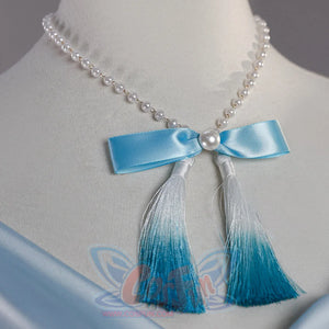 Close-up of Re:Zero Rem cosplay costume pearl necklace with blue bow and gradient tassels on the dress neckline