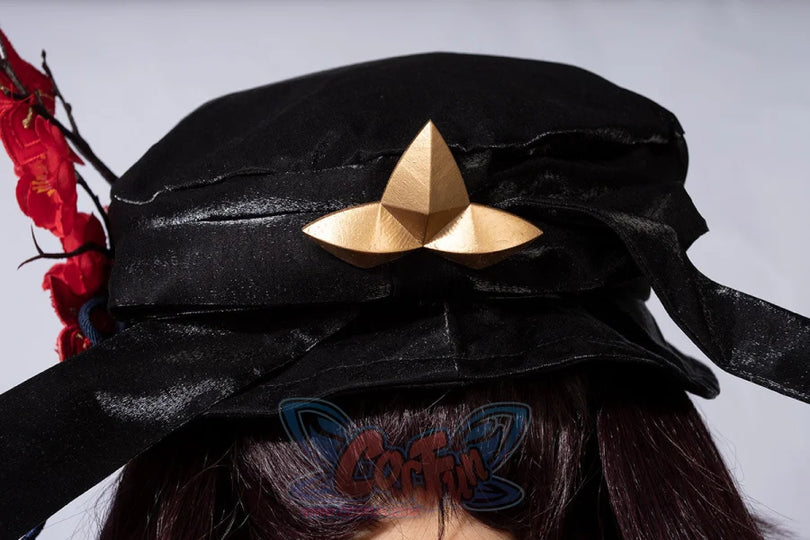 Genshin Impact Hu Tao cosplay hat anchors a gold tri-star emblem on a black ribbon beside red floral accents.