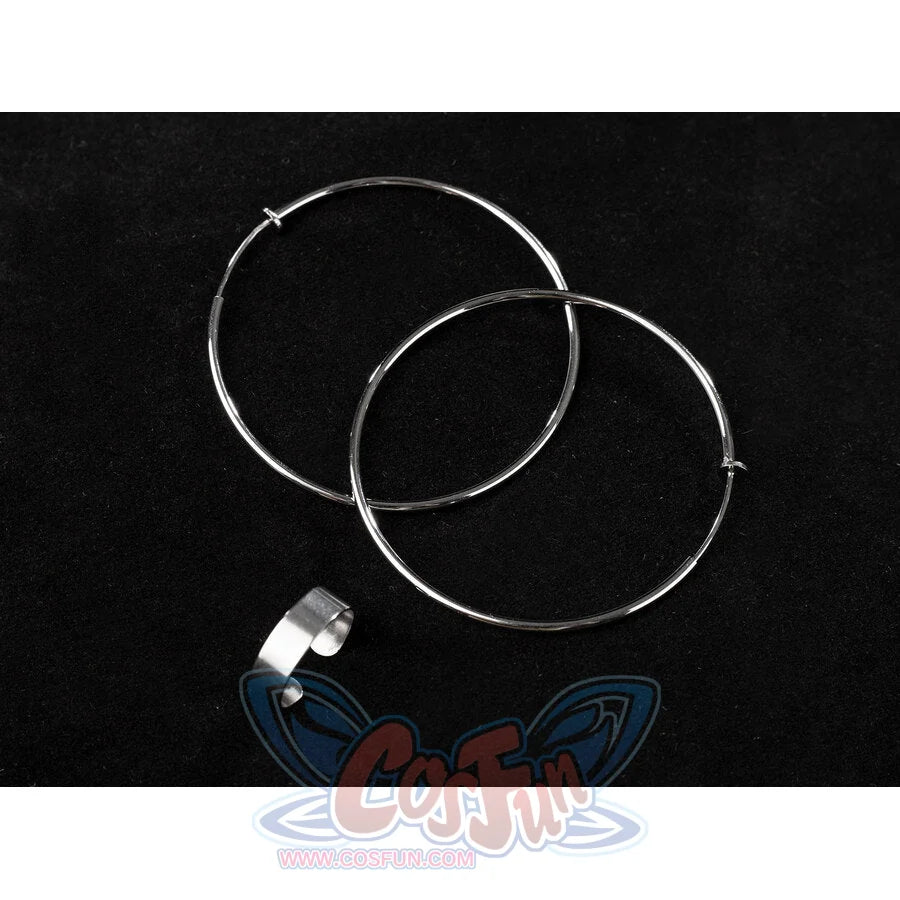 Two large silver hoop earrings and a matching silver ring accessory are displayed on a black background
