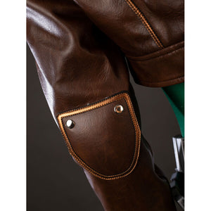 Close-up detail of Rogue cosplay brown jacket sleeve with a stitched elbow patch and snap rivets