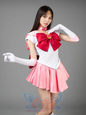 Sailor Chibi cosplay costume styled pose balances the pink bow above soft rose pleats