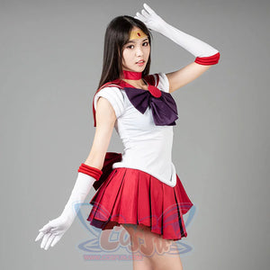 Sailor Moon Sailor Mars cosplay costume angled pose raises a white glove above a purple bow and red pleated skirt.