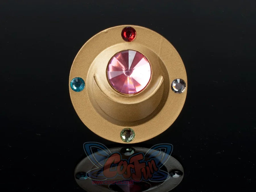 Sailor Moon Usagi Tsukino cosplay brooch close-up highlights a gold-tone frame and red center